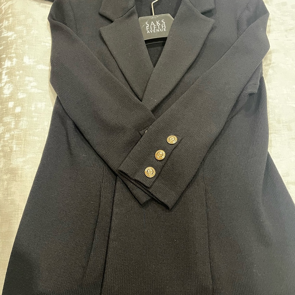 Saks Fifth Avenue St John Caviar suit with wide leg pants.